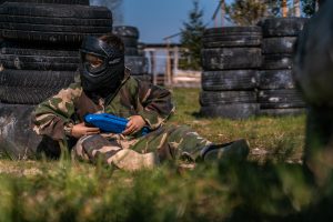 boy playing paintball for kids